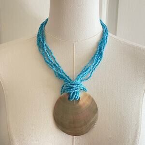 Multistrand Blue Beaded Necklace with a Shell Pendant